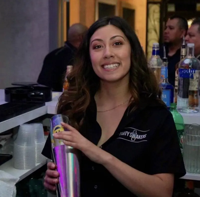 Why a Bartender with a right attitude matters? | Female bartenders holding shakers and smiling | Bartender with a right attitude matters